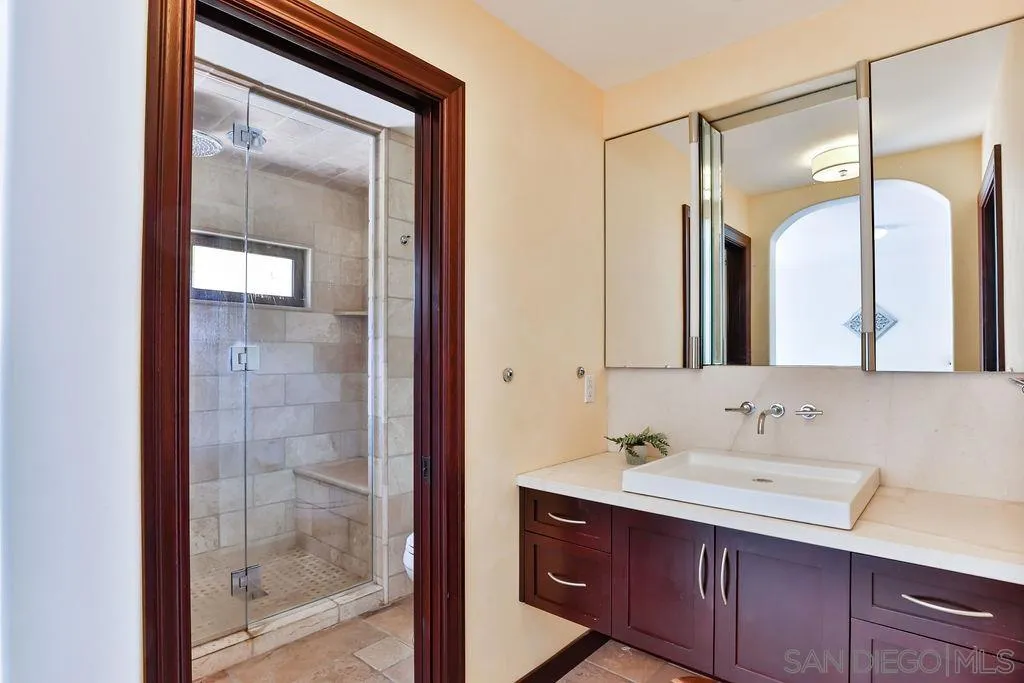 2038 Valley Rim Road El Cajon, CA 92019 - Photo 14 of 37 a bathroom with a sink and a mirror