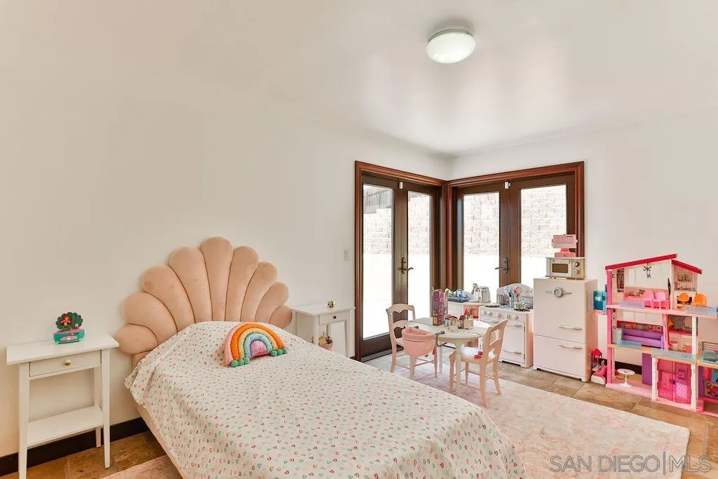 2038 Valley Rim Road El Cajon, CA 92019 - Photo 17 of 37 a bedroom with furniture and a large window