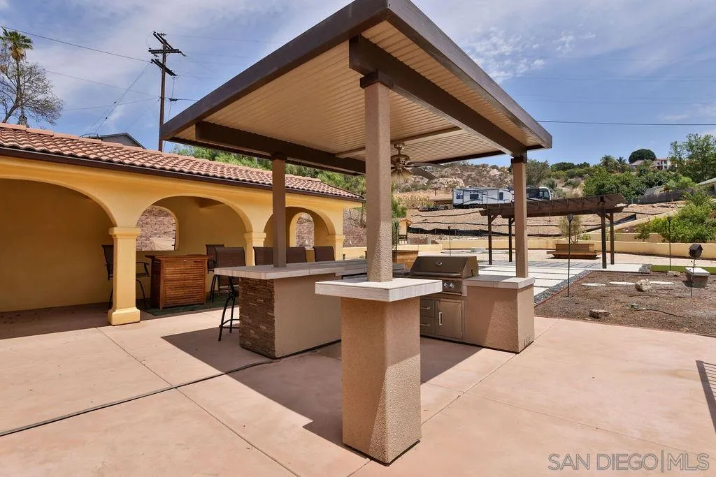 2038 Valley Rim Road El Cajon, CA 92019 - Photo 20 of 37 a view of a patio with a table and chairs