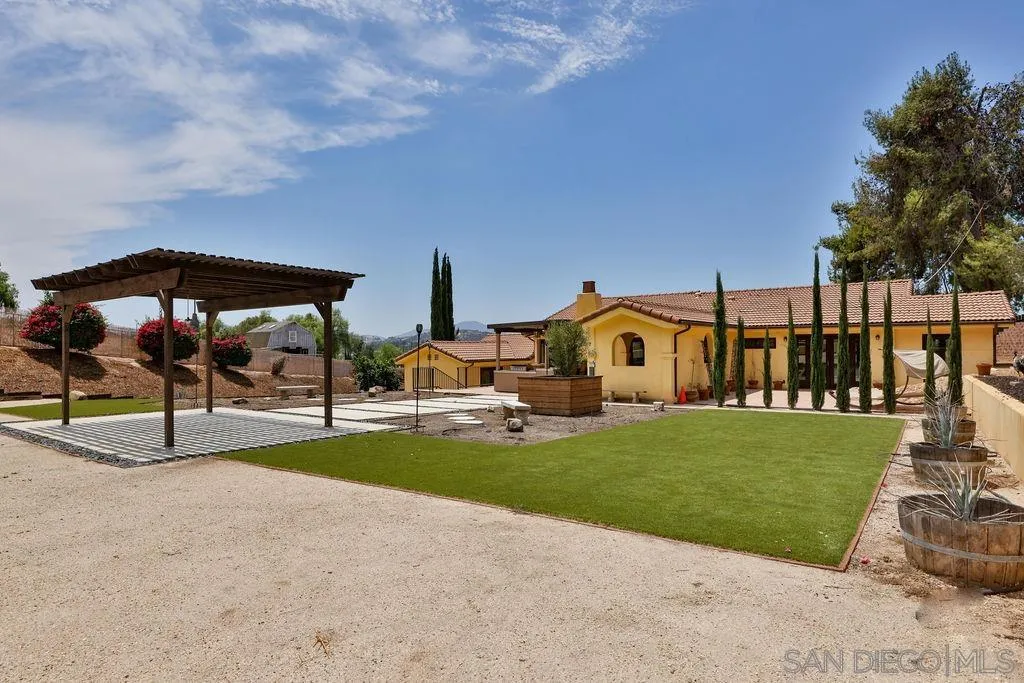 2038 Valley Rim Road El Cajon, CA 92019 - Photo 23 of 37 a view of a house with backyard porch and sitting area