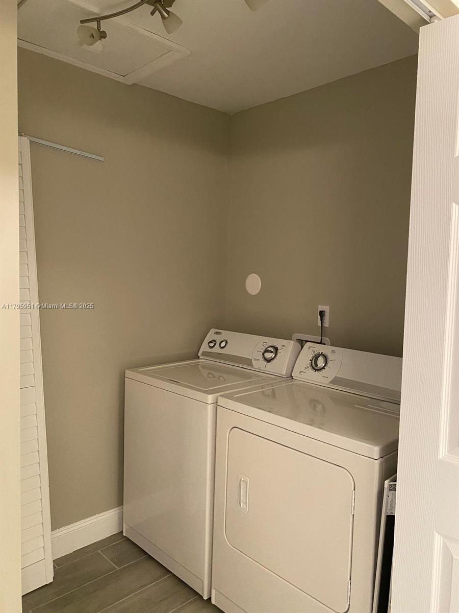 3906 Northwest 207 St Road, Unit 3906 Miami Gardens, FL 33055 - Photo 16 of 19 a utility room with dryer and washer