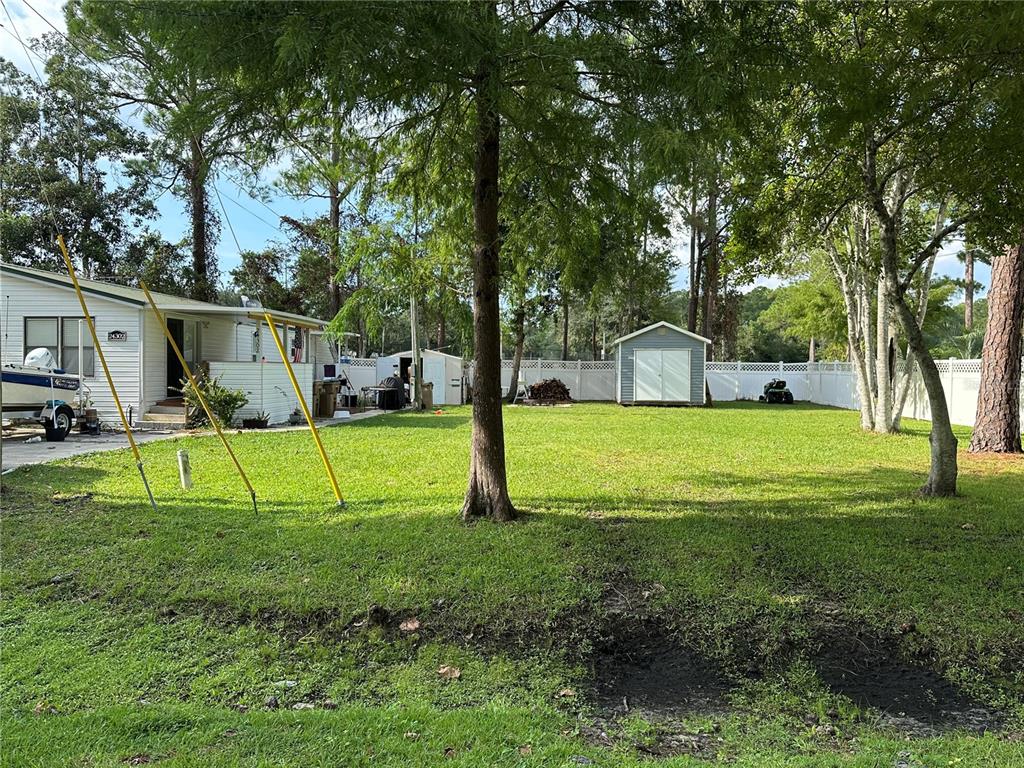 24302 Maxwell Street Astor, FL 32102 - Photo 11 of 11 a view of a house with backyard