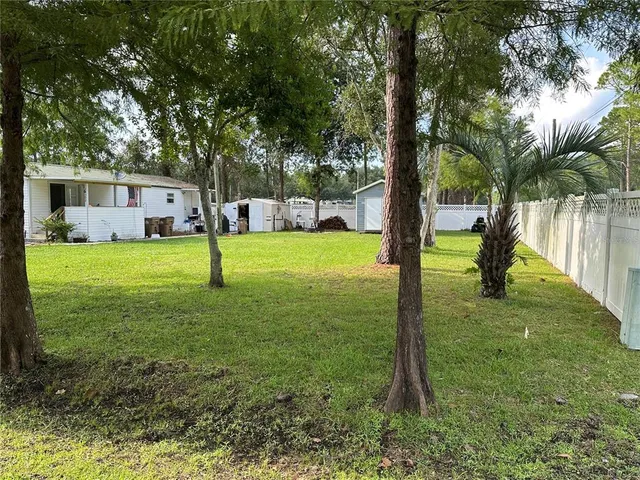 a view of a backyard with a small cabin
