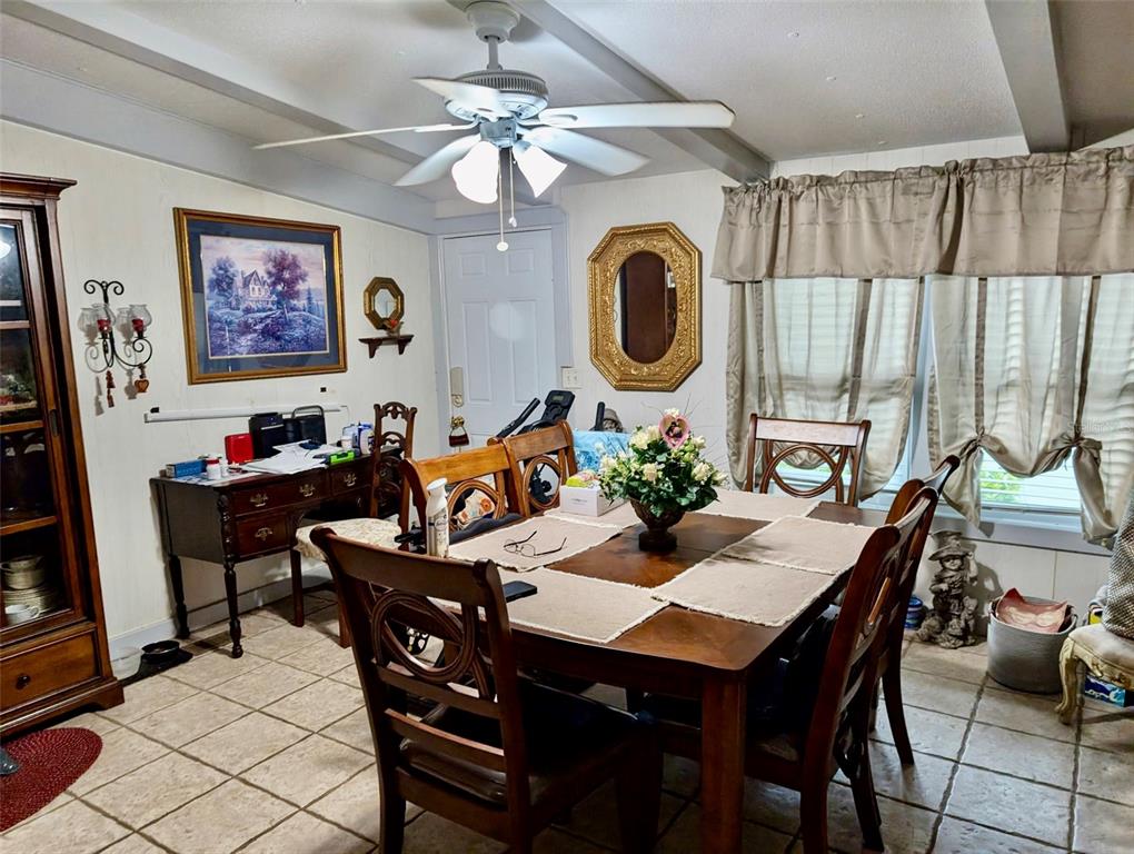 24302 Maxwell Street Astor, FL 32102 - Photo 4 of 11 a view of a dining room and a table or chairs