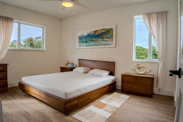 a bedroom with a bed and window