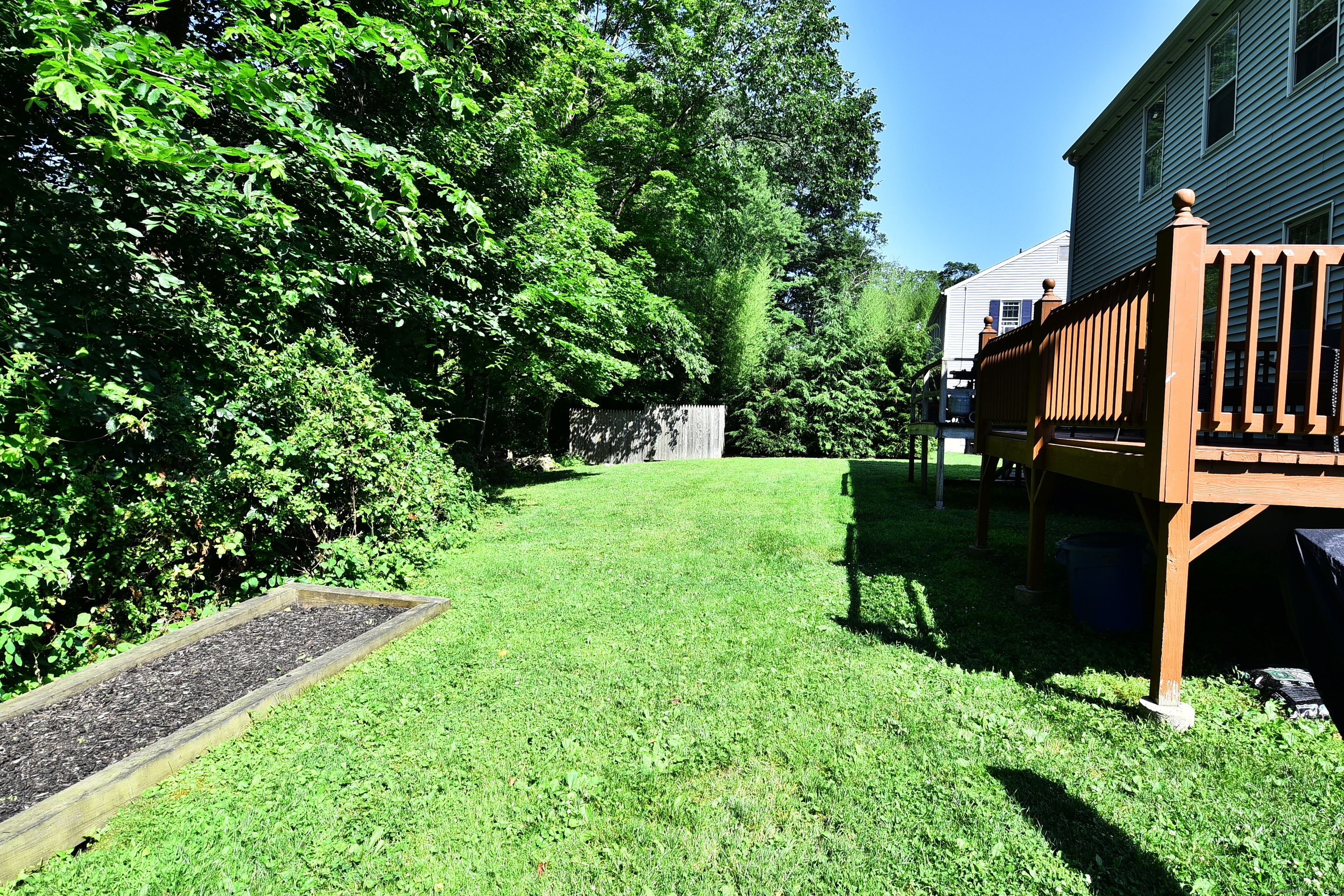 84 Parade Hill Road, Unit 84 New Canaan, CT 06840 - Photo 23 of 24 Raised garden bed in backyard.