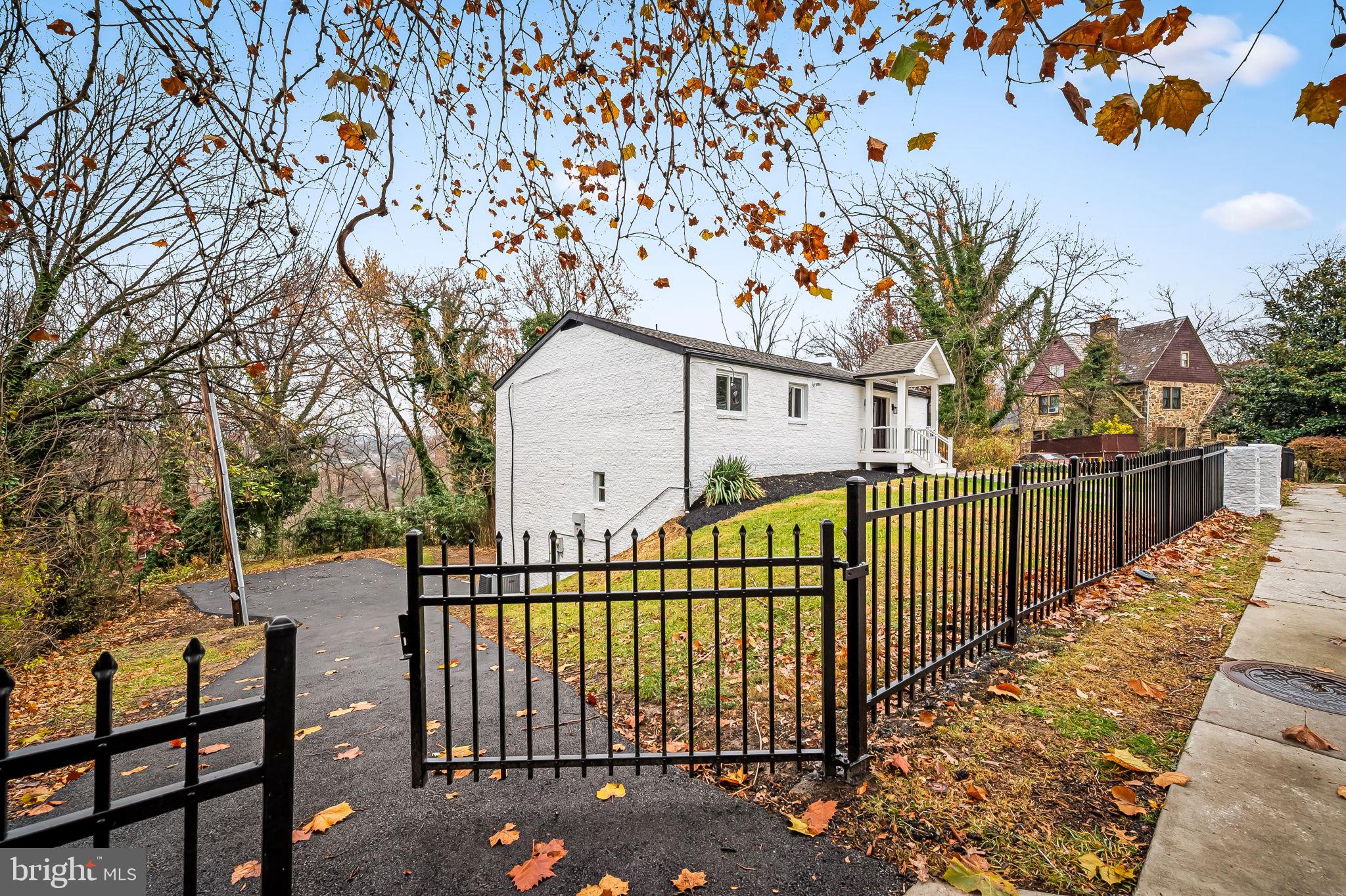 a view of a wrought iron fences in front of house