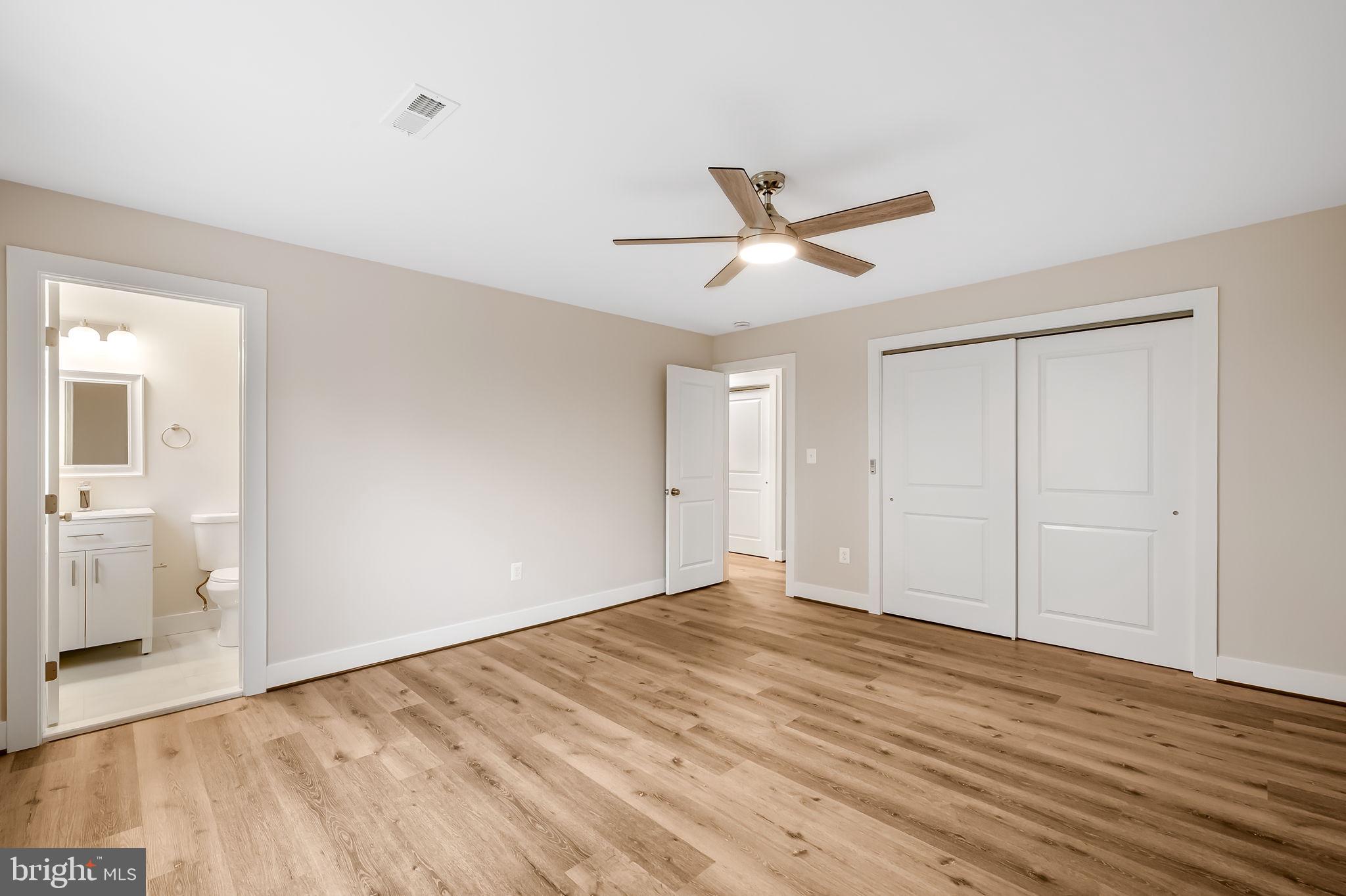 113 Edgewood Road Towson, MD 21286 - Photo 17 of 48 a view of empty room with wooden floor and ceiling fan