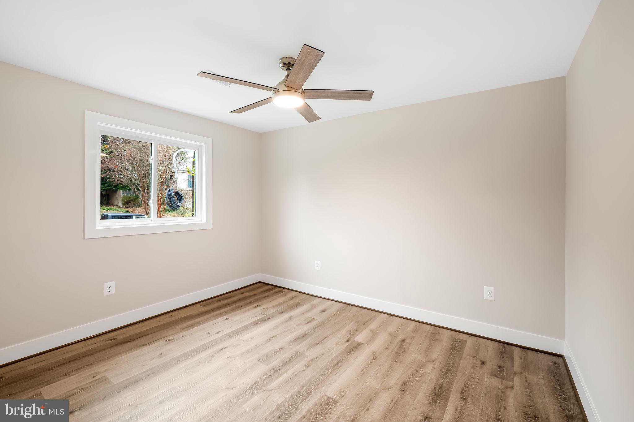 113 Edgewood Road Towson, MD 21286 - Photo 20 of 48 a view of empty room with wooden floor and fan