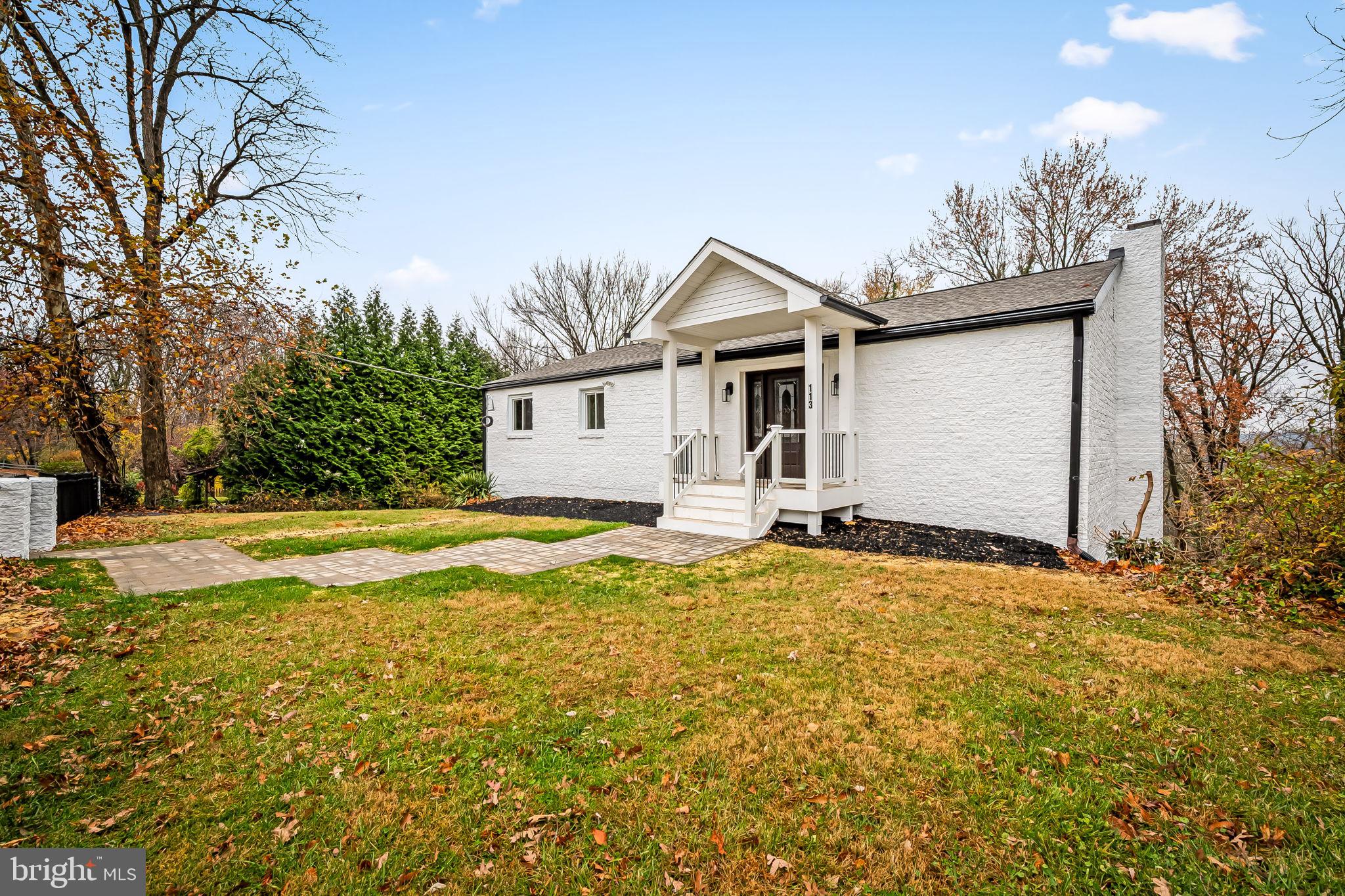 113 Edgewood Road Towson, MD 21286 - Photo 2 of 48 a white house that has a tree in front of it
