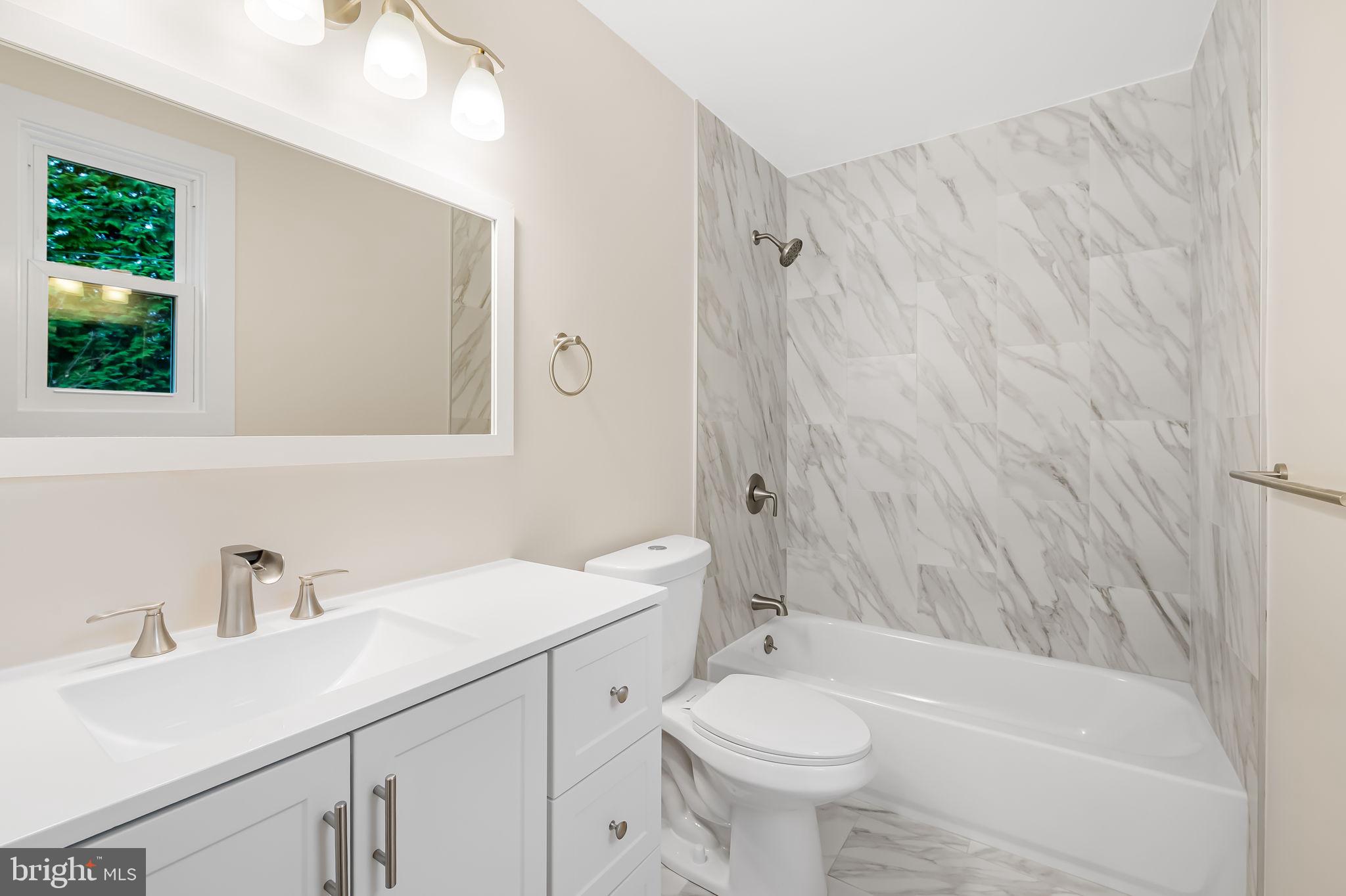 113 Edgewood Road Towson, MD 21286 - Photo 25 of 48 a bathroom with a sink a toilet and shower