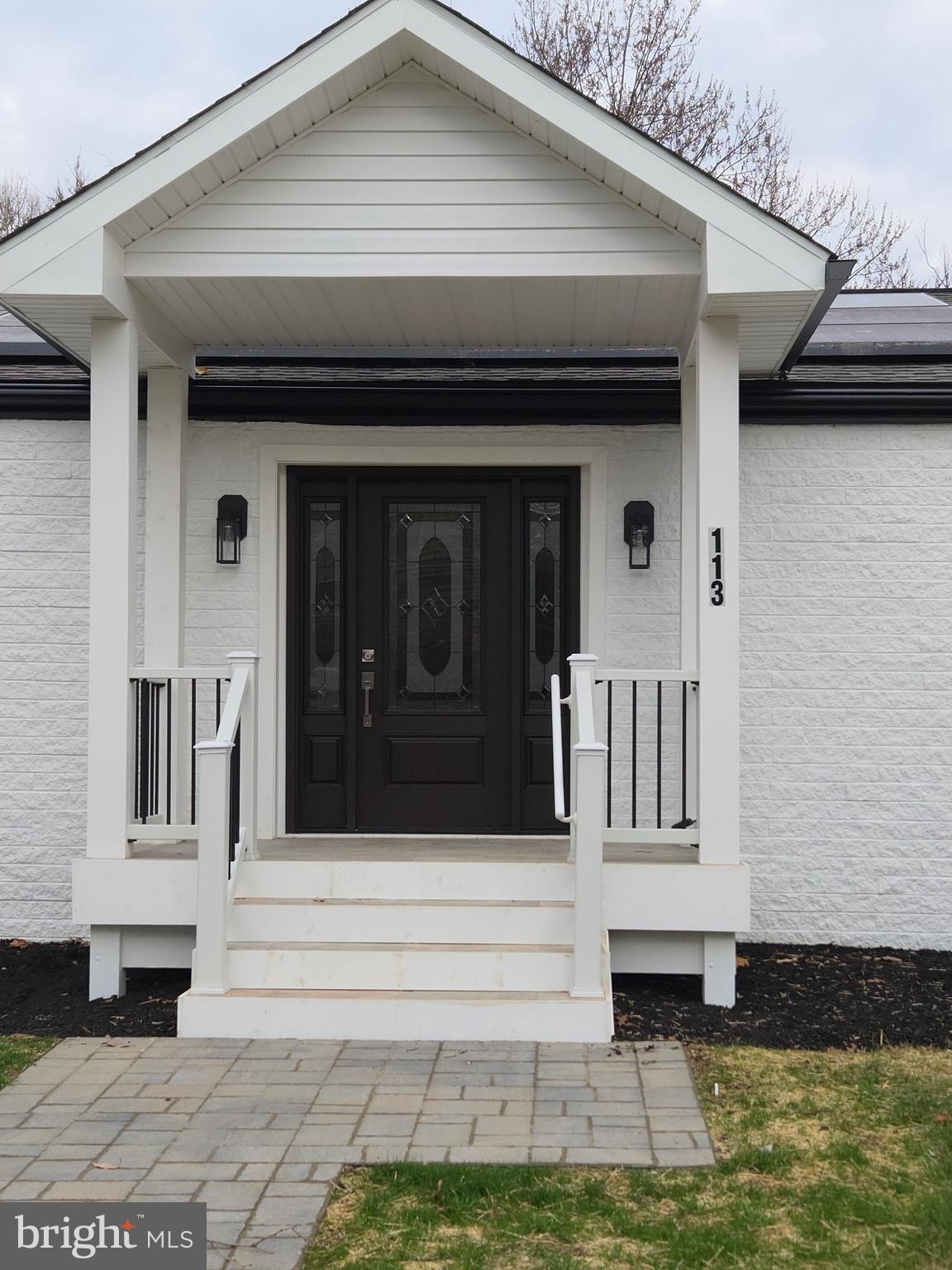 113 Edgewood Road Towson, MD 21286 - Photo 3 of 48 a front view of a house with a small garden