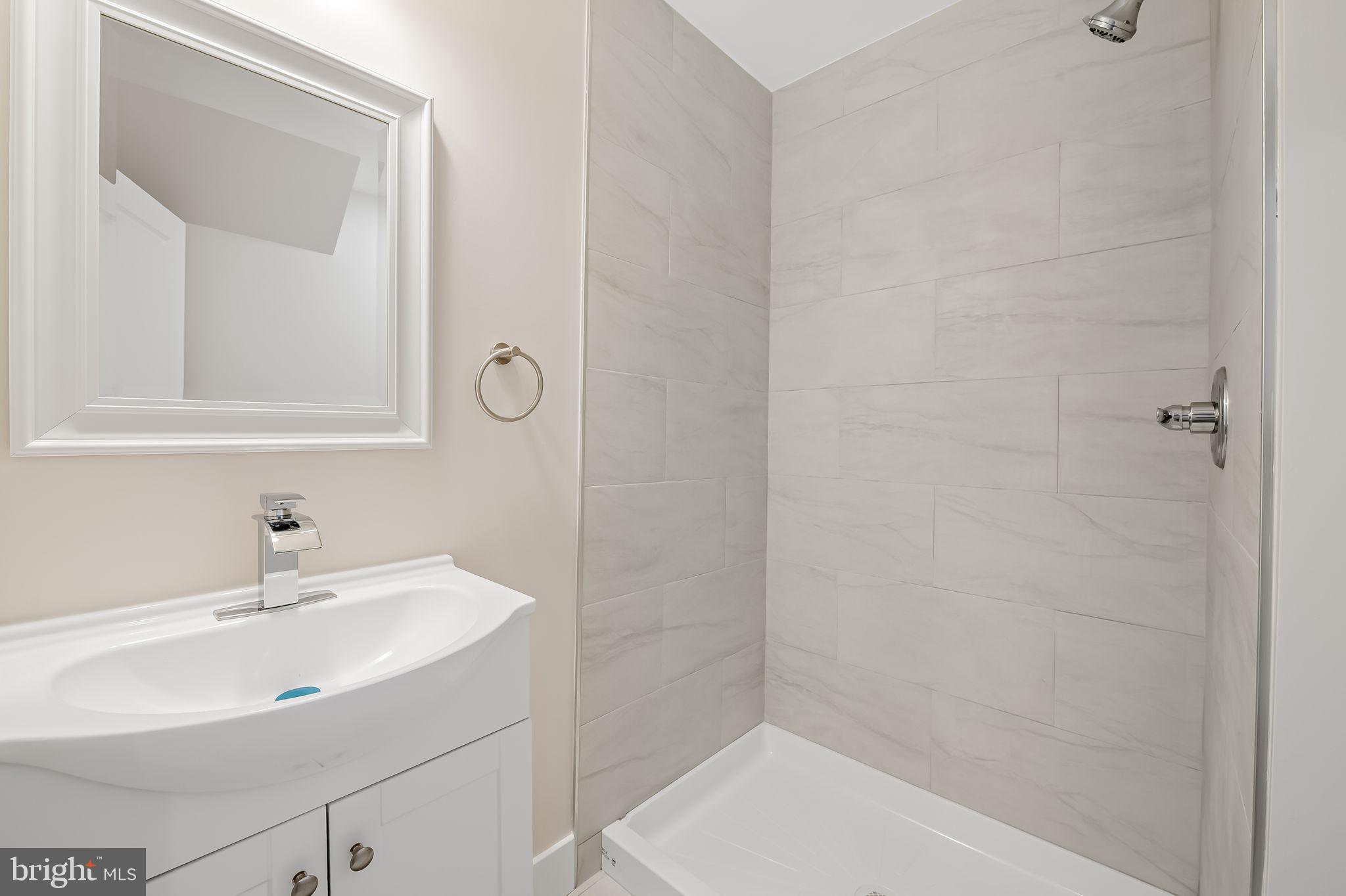 113 Edgewood Road Towson, MD 21286 - Photo 31 of 48 a bathroom with a sink and a mirror