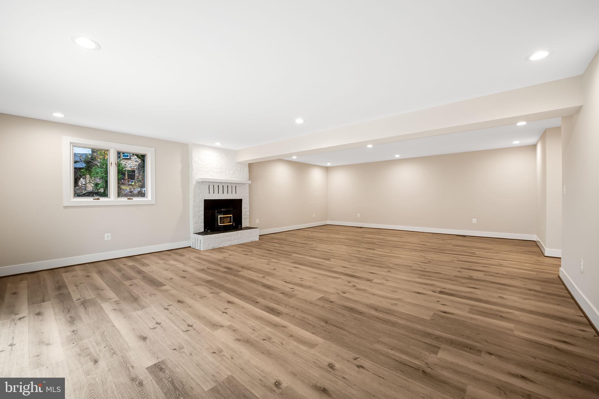 113 Edgewood Road Towson, MD 21286 - Photo 32 of 48 an empty room with wooden floor and windows