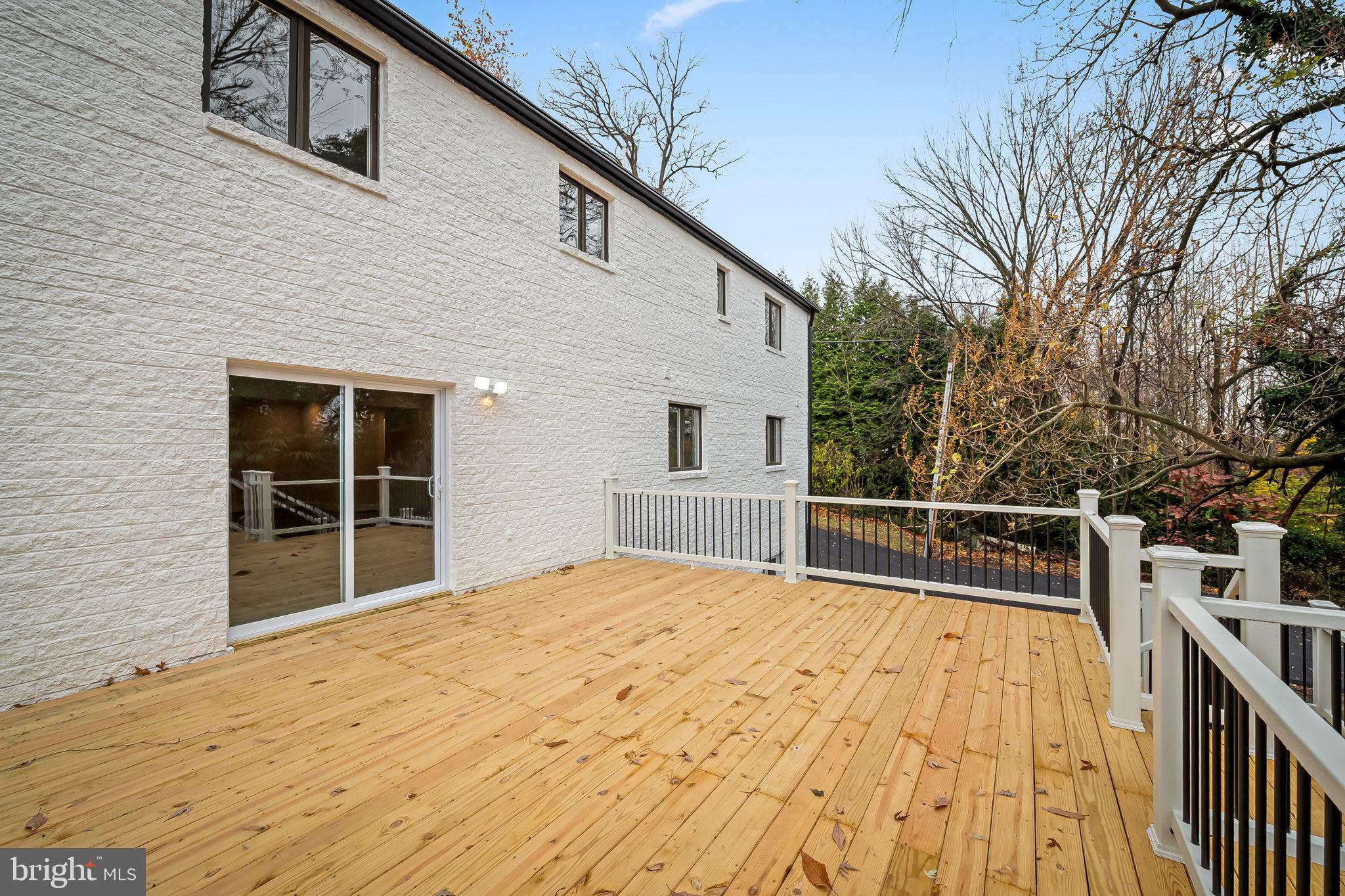 113 Edgewood Road Towson, MD 21286 - Photo 37 of 48 a view of backyard with large trees and wooden fence