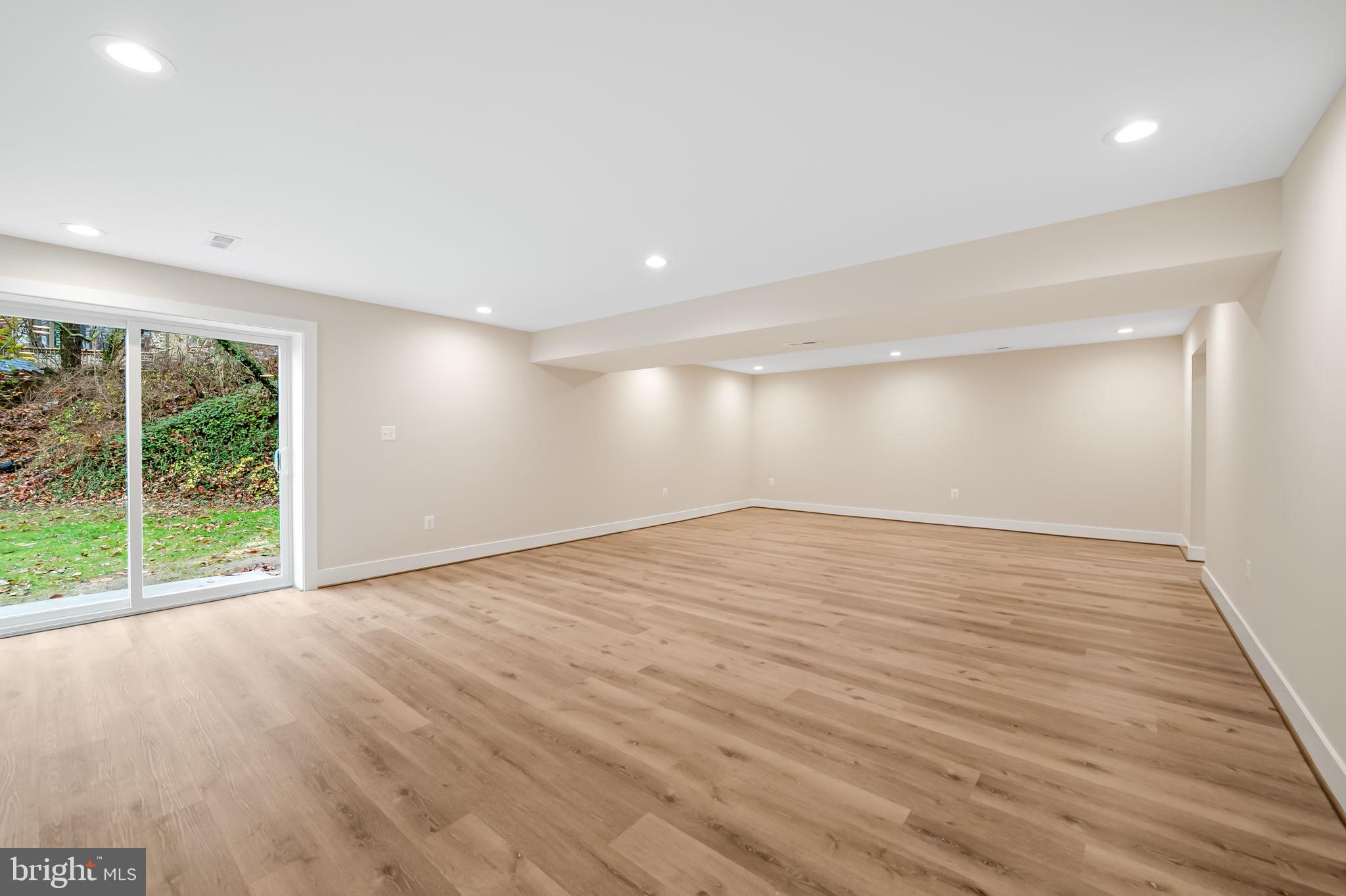 113 Edgewood Road Towson, MD 21286 - Photo 40 of 48 a view of an empty room with wooden floor and a window