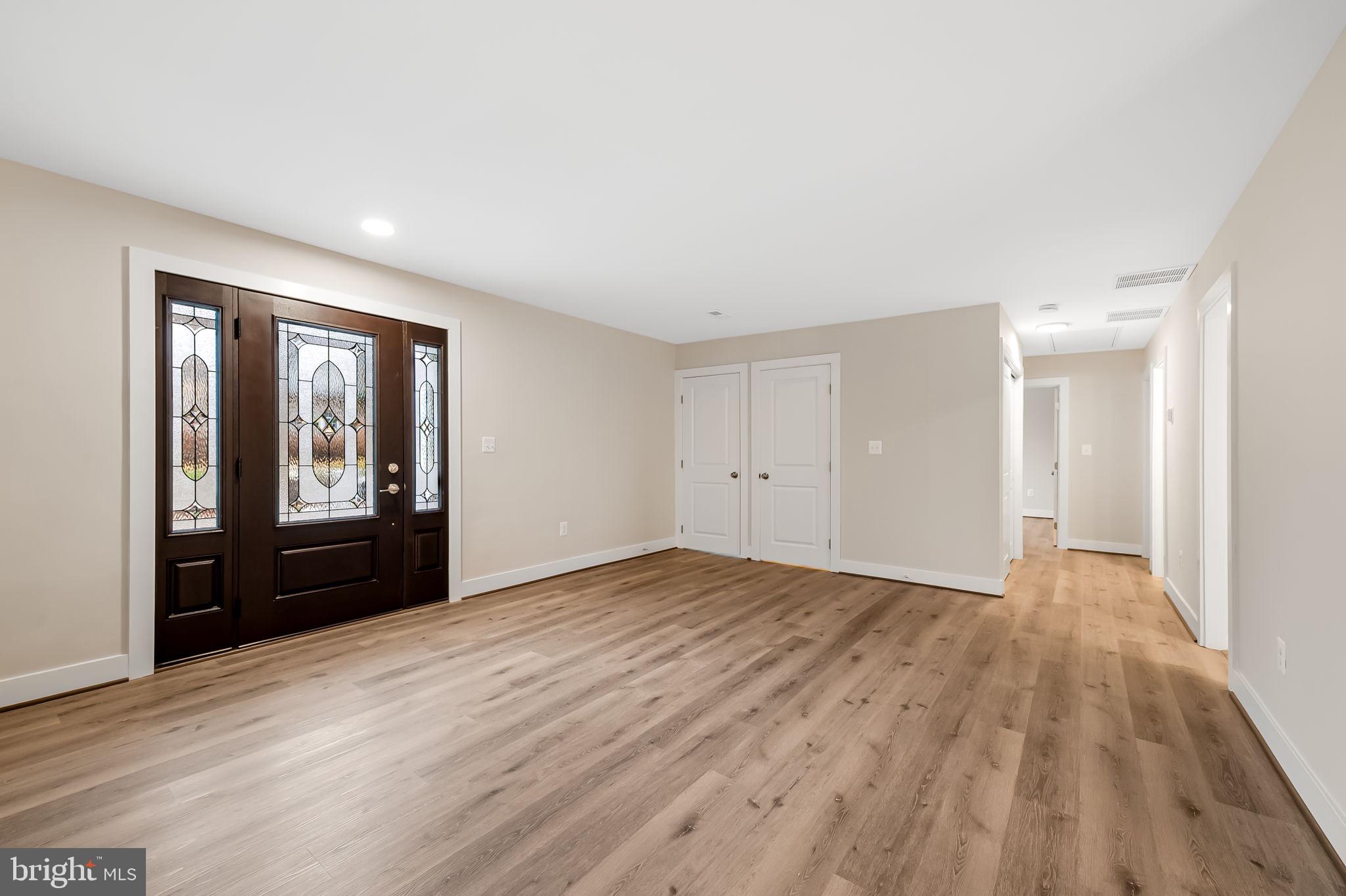 113 Edgewood Road Towson, MD 21286 - Photo 8 of 48 a view of an empty room with window and wooden floor