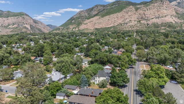 1256 24th Street Ogden, UT 84401 - Photo 33 of 34 Aerial perspective of a tree-lined residential area framed by distant mountains