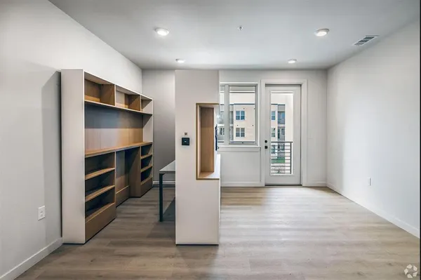 a view of kitchen and wooden floor
