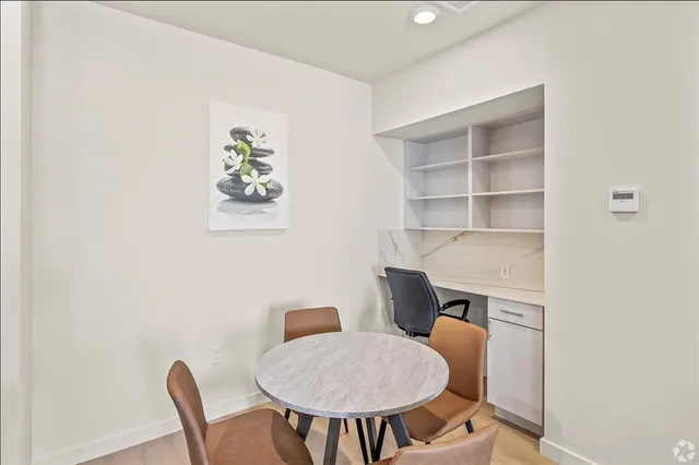 a workspace with furniture and window