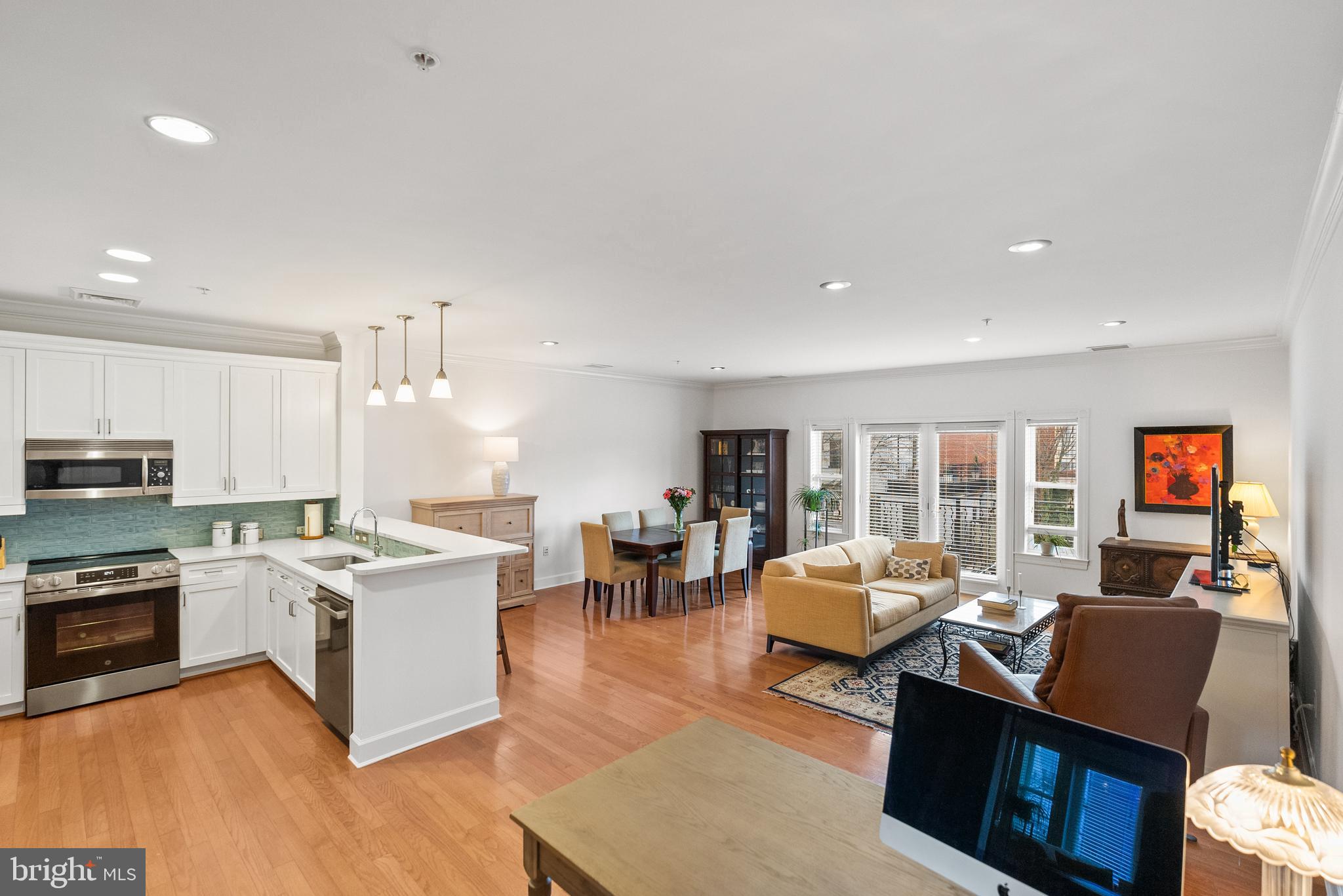 401 13th Street Northeast, Unit 313 Washington, DC 20002 - Photo 15 of 45 a living room with stainless steel appliances granite countertop furniture and a kitchen view