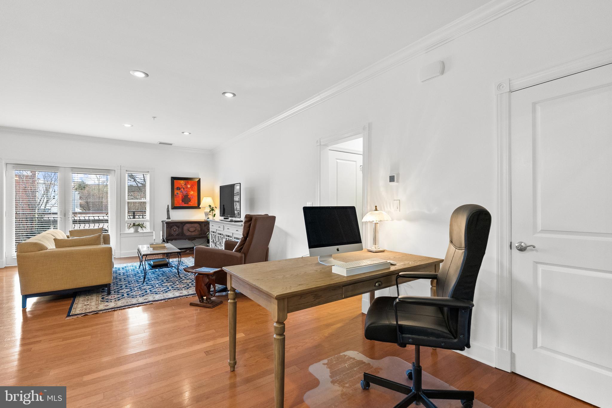 401 13th Street Northeast, Unit 313 Washington, DC 20002 - Photo 26 of 45 a view of a workspace with furniture and a window