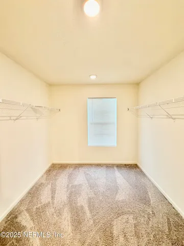a bathroom with a double vanity sink toilet and shower