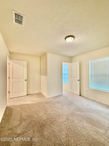 a bathroom with a granite countertop sink toilet a mirror and bathtub