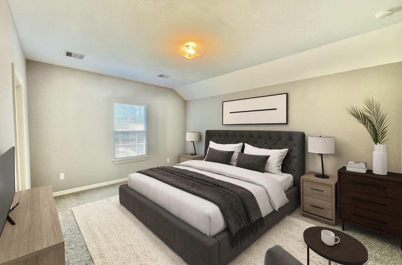 6017 East Houston Road Houston, TX 77028 - Photo 5 of 13 a bedroom with a bed and a potted plant