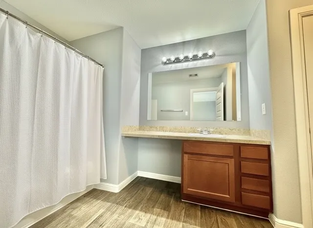 a bathroom with a sink and a mirror