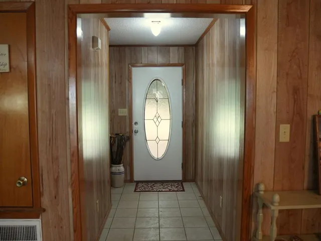 a view of a hallway with windows