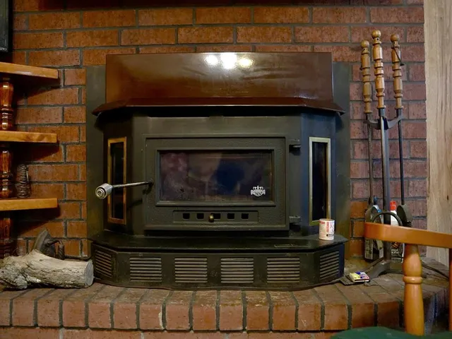 a stove top oven sitting inside of a kitchen