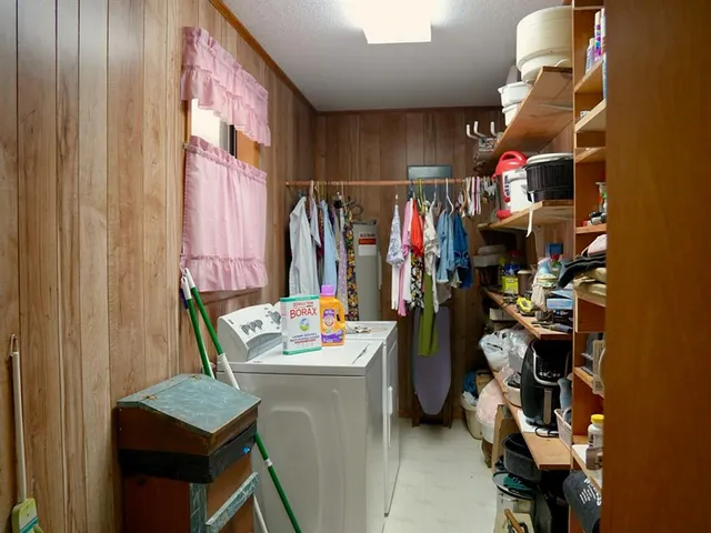 a bedroom with a bed and lamps