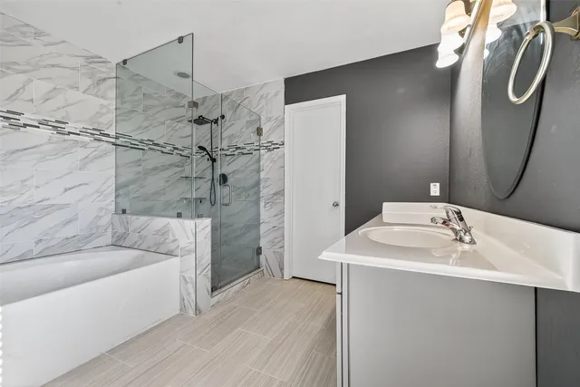 a bathroom with a sink and shower