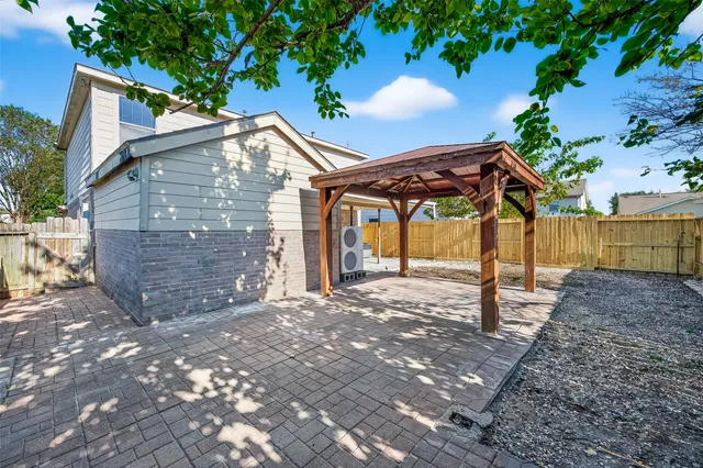 a view of a house with a tree