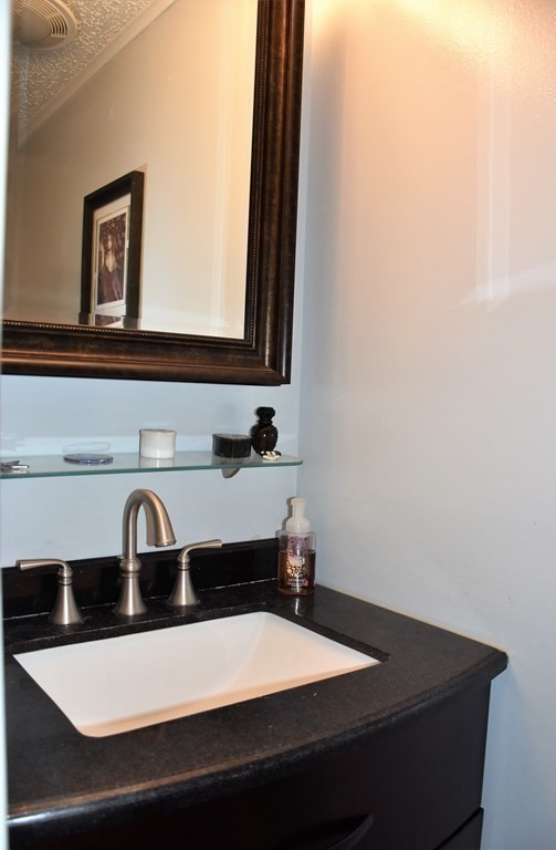 23 Bernie Road Holland, MA 01521 - Photo 24 of 36 a bathroom with a sink and a mirror