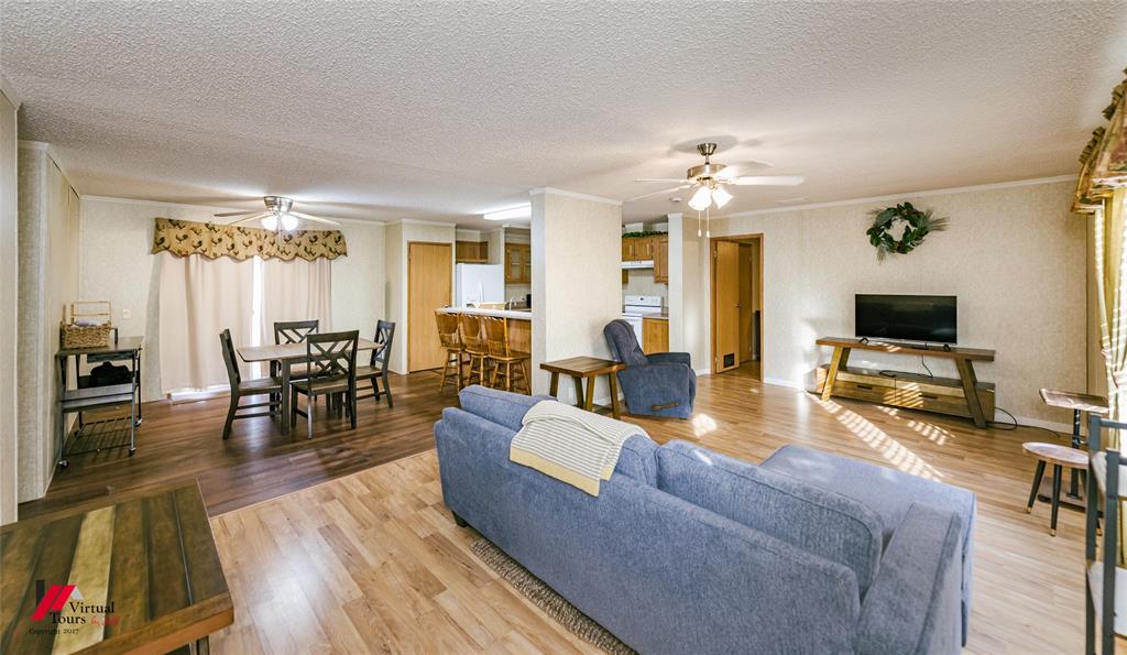 259 Kings Circle Grand Cane, LA 71032 - Photo 11 of 38 a living room with furniture and a flat screen tv with wooden floor