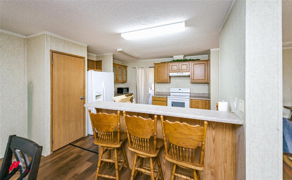 259 Kings Circle Grand Cane, LA 71032 - Photo 13 of 38 a view of a kitchen counter space and wooden floor