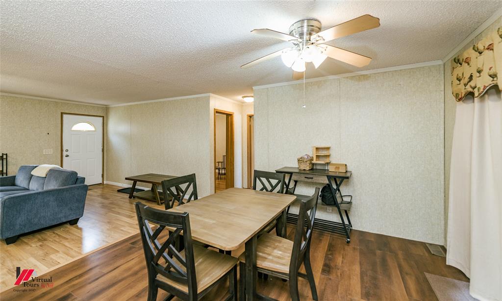 259 Kings Circle Grand Cane, LA 71032 - Photo 14 of 38 a view of a dining room with furniture and wooden floor
