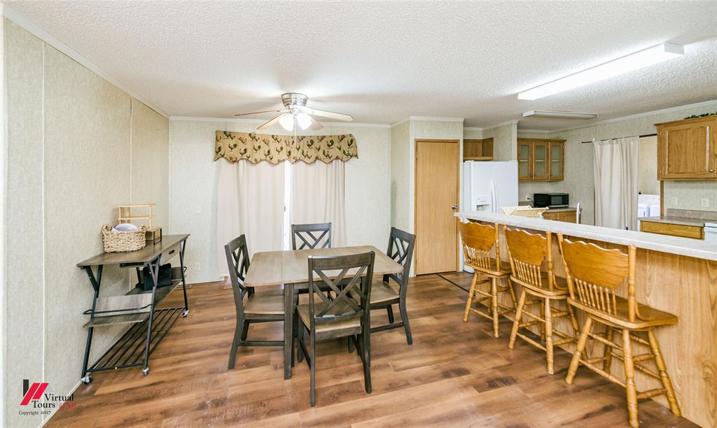 259 Kings Circle Grand Cane, LA 71032 - Photo 15 of 38 a view of a dining room with furniture and a chandelier