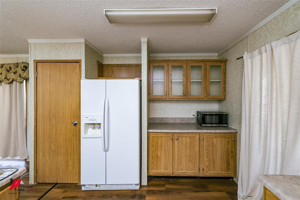 259 Kings Circle Grand Cane, LA 71032 - Photo 18 of 38 a kitchen with stainless steel appliances granite countertop a refrigerator and a stove