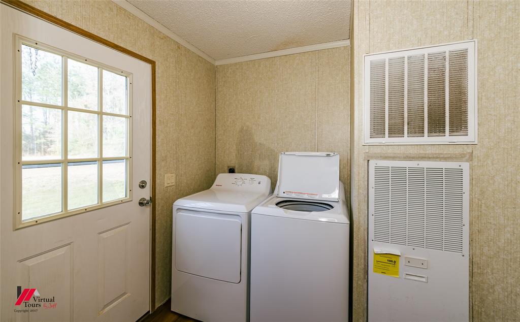 259 Kings Circle Grand Cane, LA 71032 - Photo 20 of 38 a utility room with dryer and washer