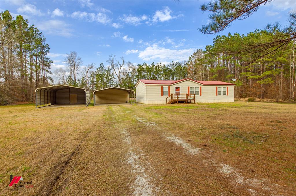 259 Kings Circle Grand Cane, LA 71032 - Photo 2 of 38 a view of a house with a yard
