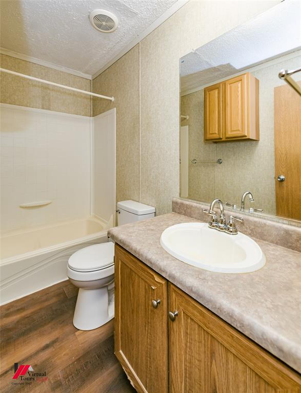 259 Kings Circle Grand Cane, LA 71032 - Photo 30 of 38 a bathroom with a granite countertop sink toilet and shower