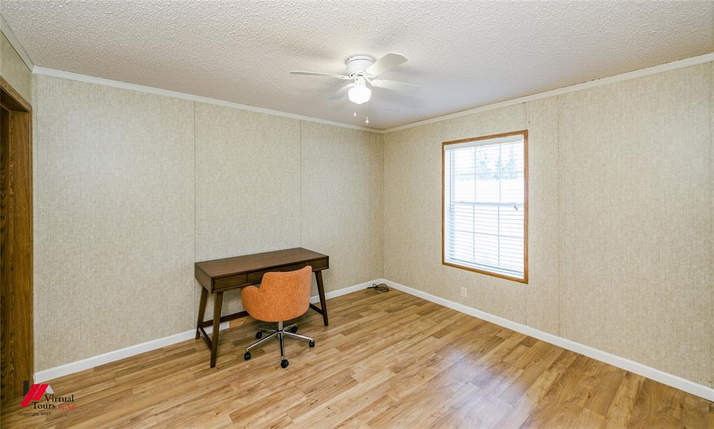 259 Kings Circle Grand Cane, LA 71032 - Photo 32 of 38 a view of a room with wooden floor and a window