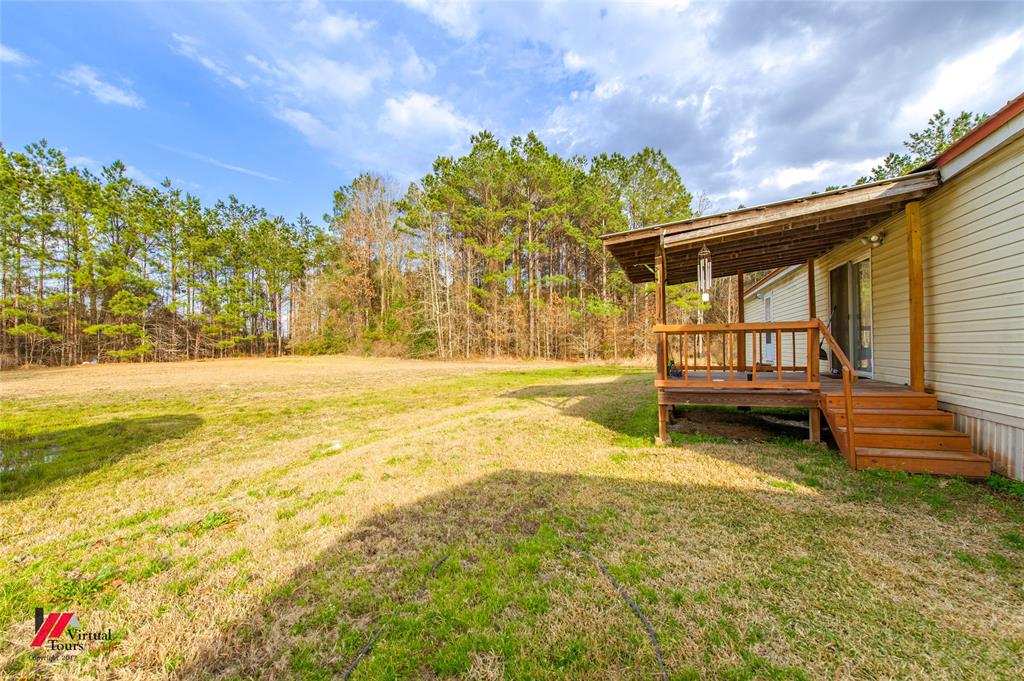 259 Kings Circle Grand Cane, LA 71032 - Photo 34 of 38 a view of a house with a yard
