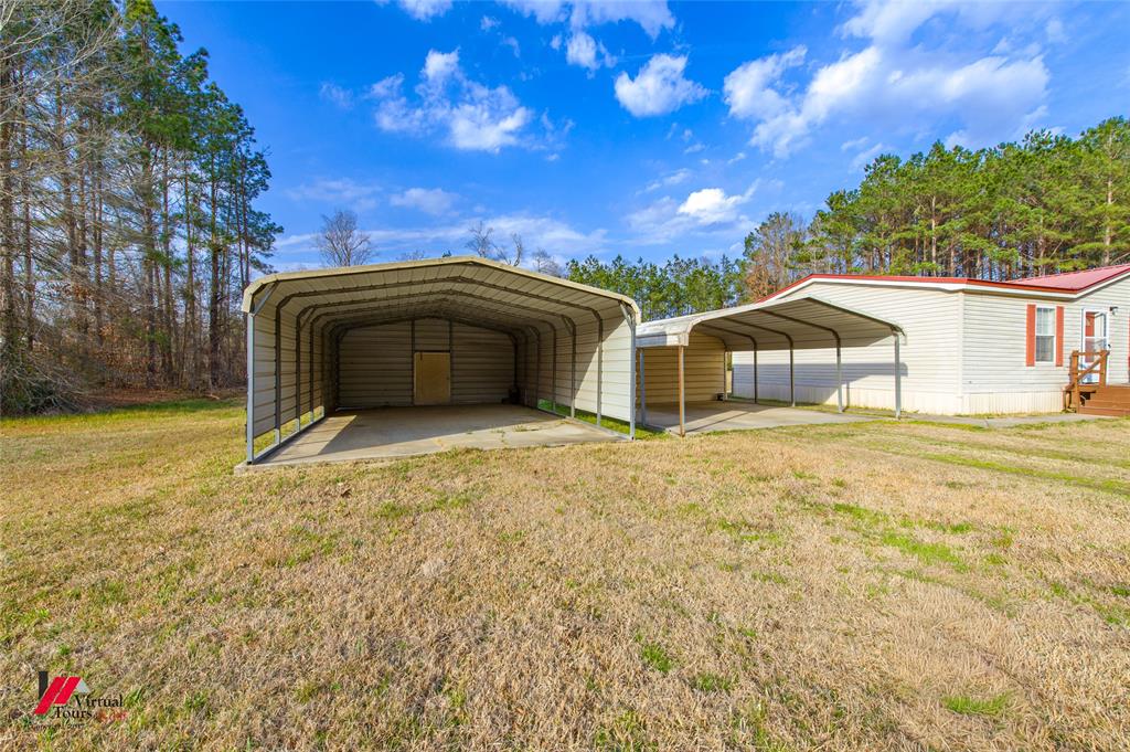 259 Kings Circle Grand Cane, LA 71032 - Photo 37 of 38 a view of a house with backyard and garden