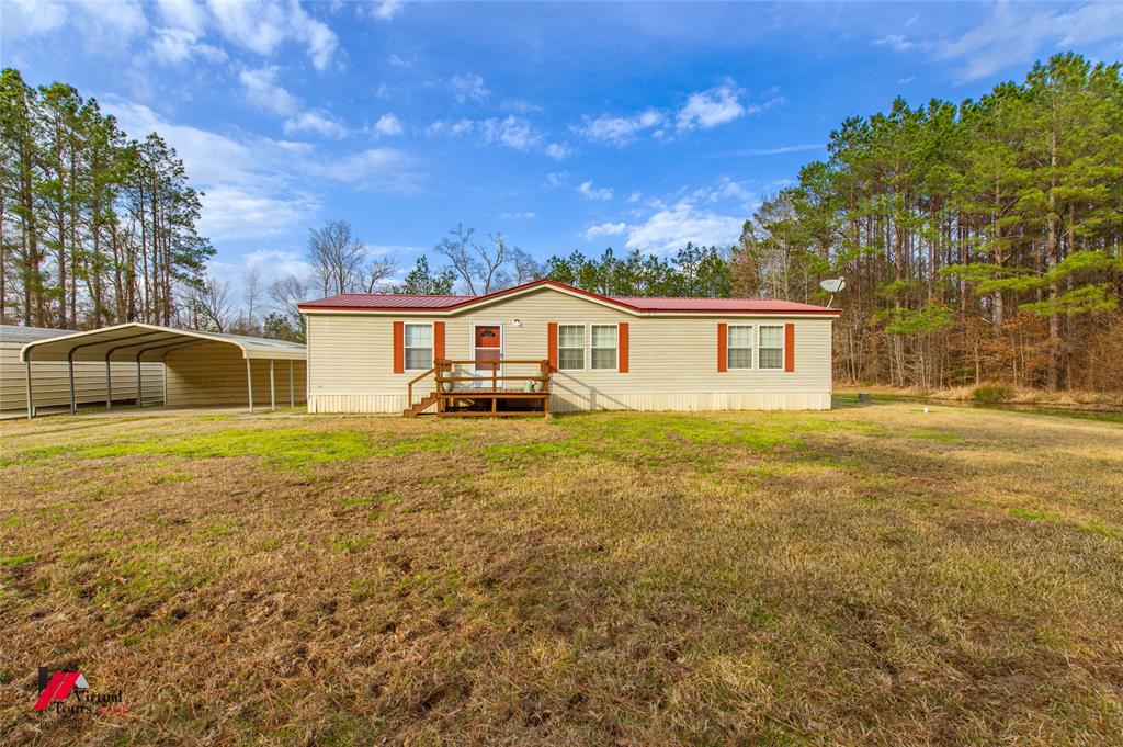 259 Kings Circle Grand Cane, LA 71032 - Photo 4 of 38 a front view of a house with a yard