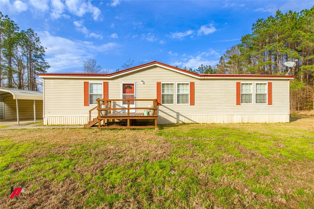 259 Kings Circle Grand Cane, LA 71032 - Photo 5 of 38 a view of a house with a yard