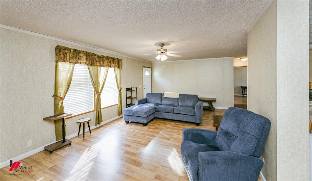 259 Kings Circle Grand Cane, LA 71032 - Photo 6 of 38 a living room with furniture and a large window